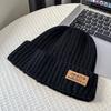Coarse thread knitted hat children autumn and winter leather label letter wool hat big head circumference warm ear protection cold hat men