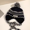 Cozy Chic Knitted Winter Hat For Women Featuring Colorful Pom Poms And Warmth
