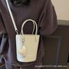 New niche simple solid color lychee pattern texture hand carrying bucket bag versatile foreign style commuting messenger women's bag