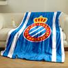 A blue background with white stripes and a crowned red circular emblem. for all seasons blanket lunch break throw gift