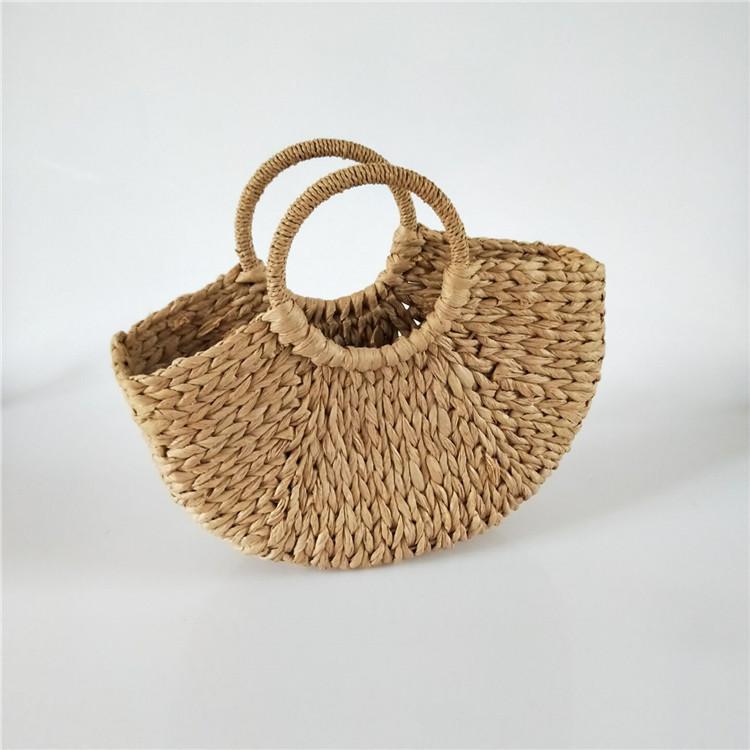 Bolsa de palha feminina moda nova primavera e verão lazer férias portátil bolsa de praia bolsa de papel trançado semi-redonda feita à mão