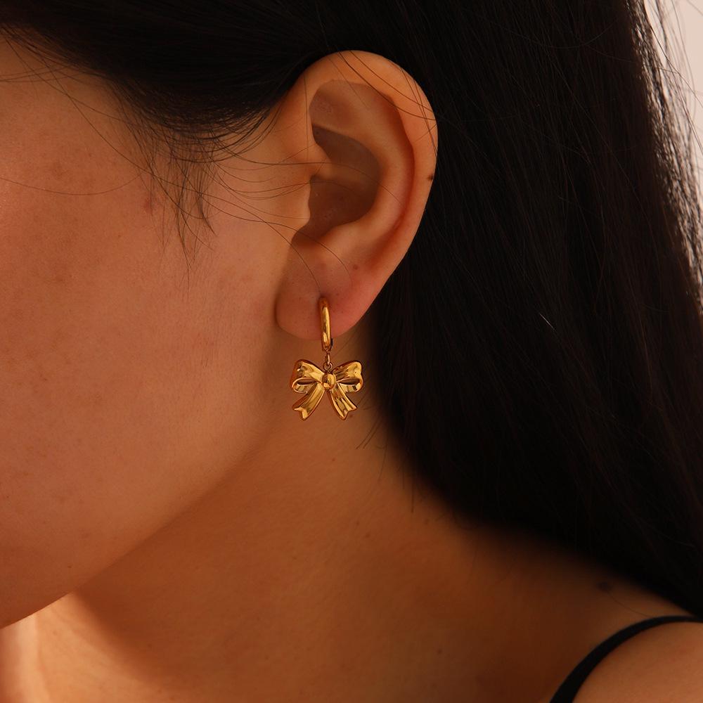 Chic Bow Coil Earrings: European & American Style In Stainless Steel