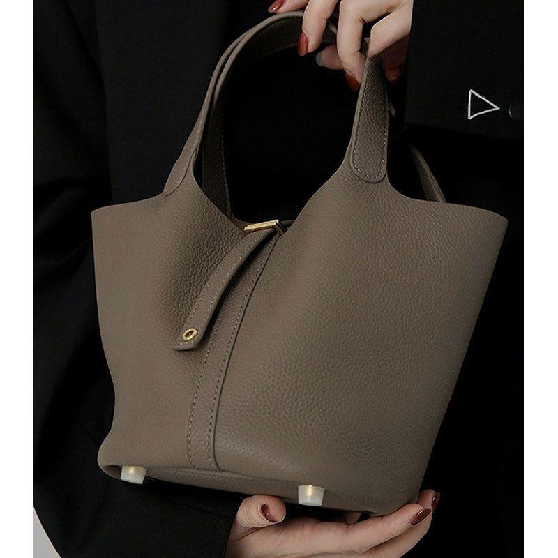 

This year, high-end texture niche elephant gray handbag is popular, women s new commuter bucket bag, women s model.