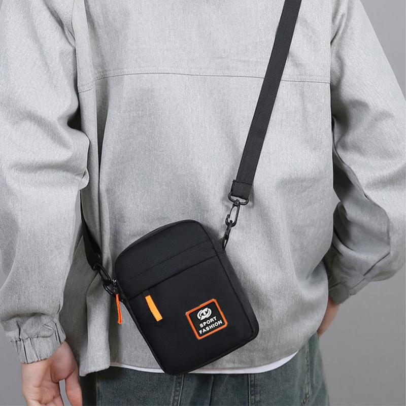 Durable Solid Men’s Crossbody Pack, Slim Lightweight Shoulder Bag with Contrast Orange Zip Decor and Patch