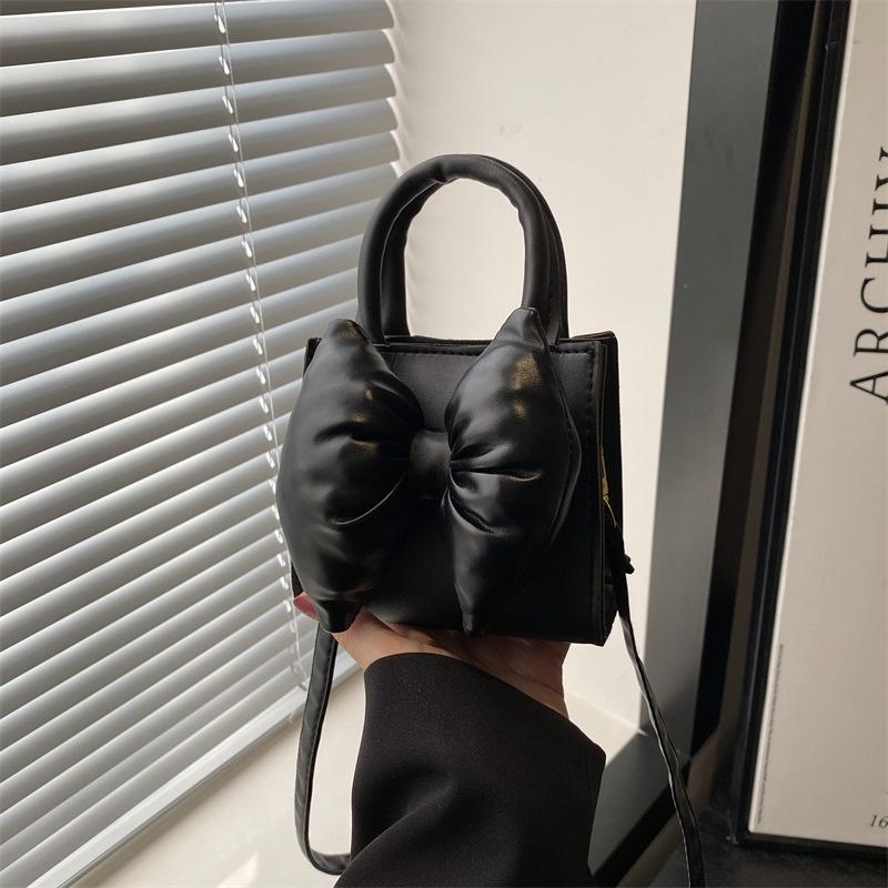 Niche bow solid color new mini hand carry small square bag summer beautiful retro shoulder messenger bag women