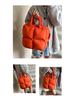 Leichte, modische bonbonfarbene Daunenjacke mit gesteppter Schulter und Puff-Crossbody-Tasche, großes Fassungsvermögen, einfarbig
