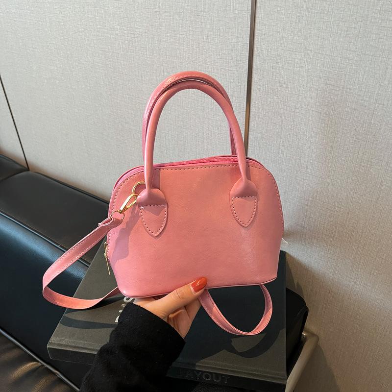 

Корейская нишевая модная портативная сумка-ракушка женская 2025 весна новая в иностранном стиле высокая ценность на одно плечо сумка-мессенджер