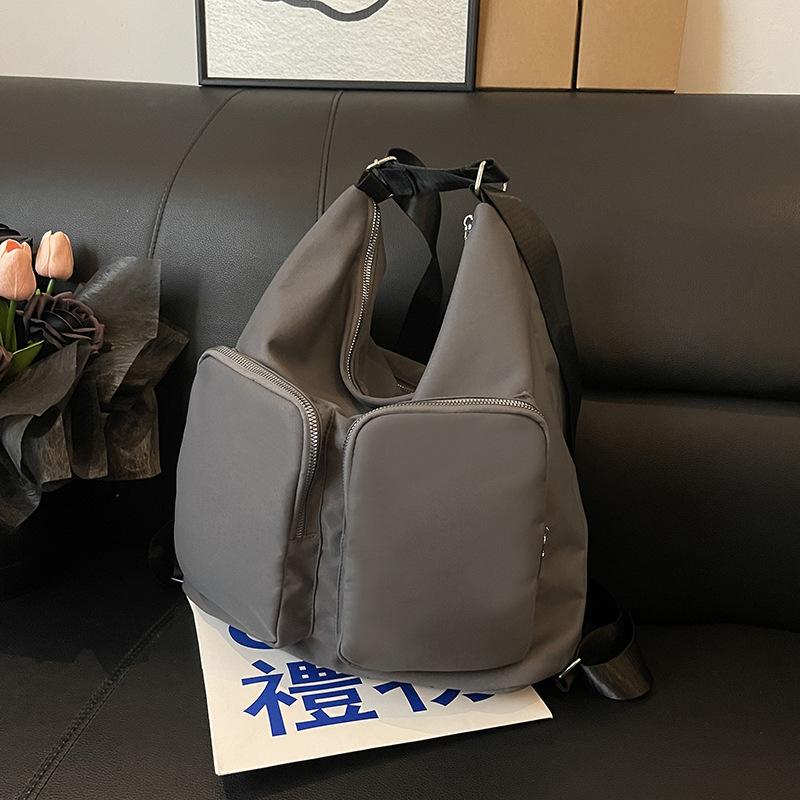 

Outdoor travel lightweight waterproof backpack large capacity versatile class bag commuting computer backpack mommy bag серый