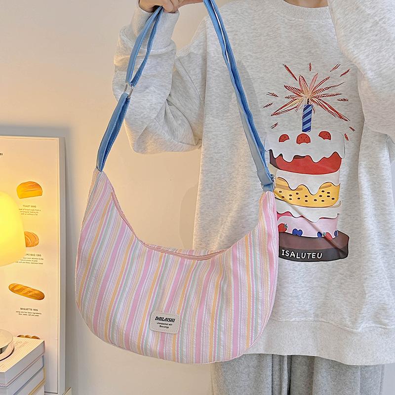 

Canvas bag female student shoulder dumpling bag trendy new casual commuting versatile messenger crescent bag розовый