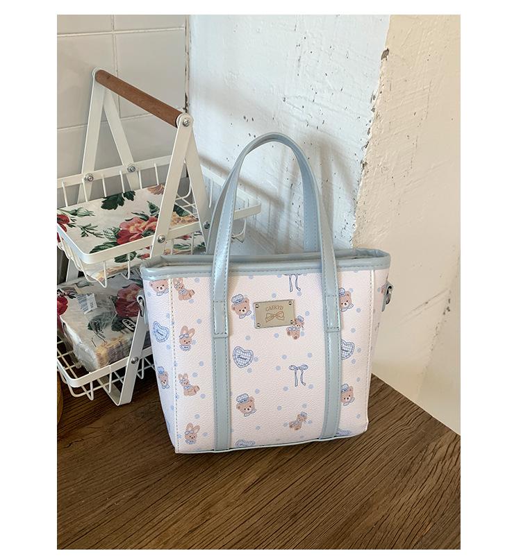 

Cartoon printed hand-held bag women s 2025 new Korean version ins bucket bag foreign niche one-shoulder crossbody bag синій
