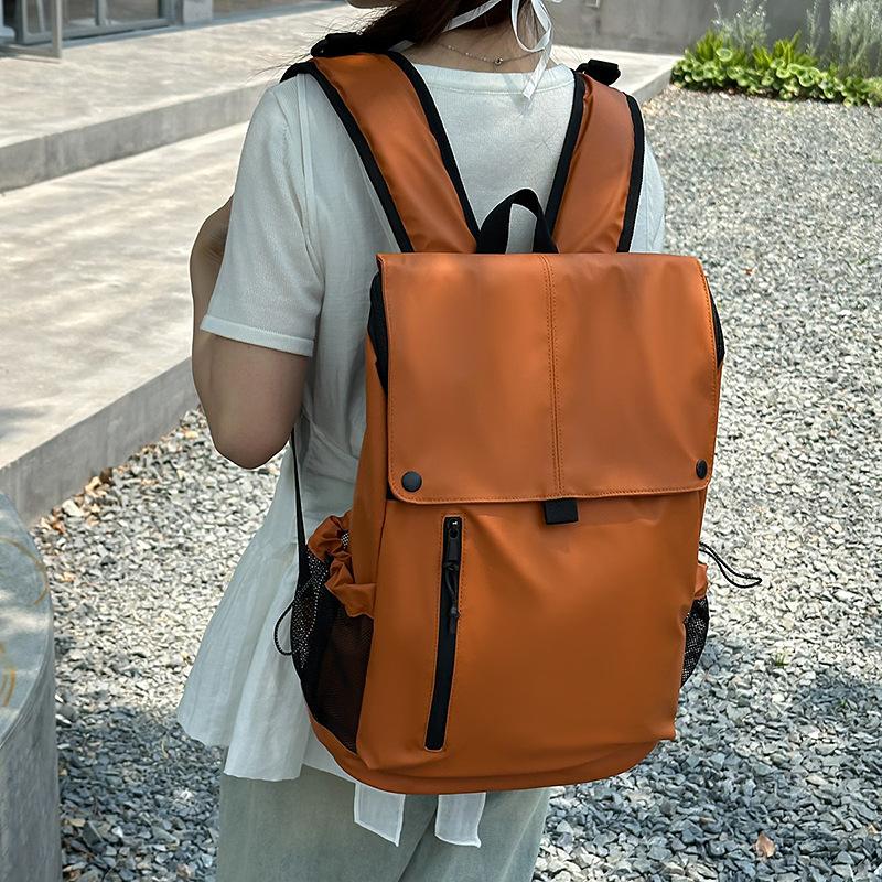 Leather film neutral large capacity large cover student backpack new locomotive wind leisure waterproof backpack оранжевый