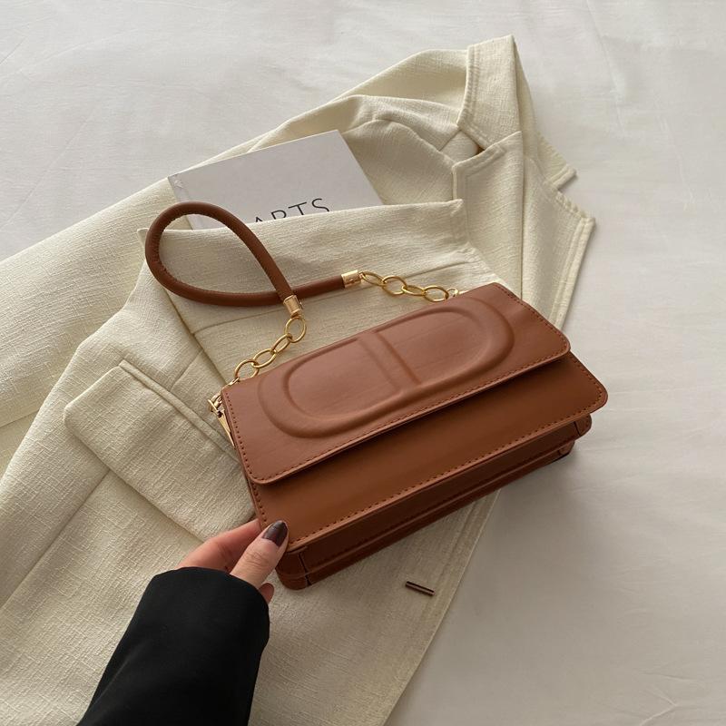 

This year s popular fashion Korean version of women s bags, versatile messenger bags ins solid color Internet celebrity shoulder armpit bag 2025 new m коричневый