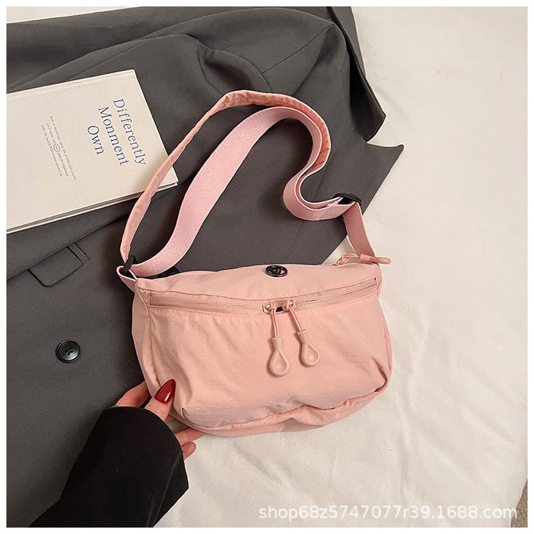 

Cute versatile niche bag women s new Korean version of simple large-capacity women s bag fashion student messenger canvas bag розовый