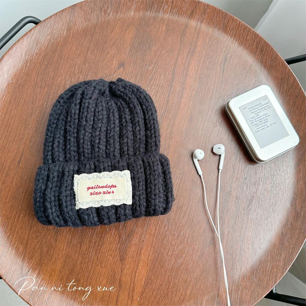 Neue Spitze Etikett Kinder Wollmütze Nuojiji Student Herbst und Winter Neu Warm und Vielseitig Ohrenschutz Strickmütze