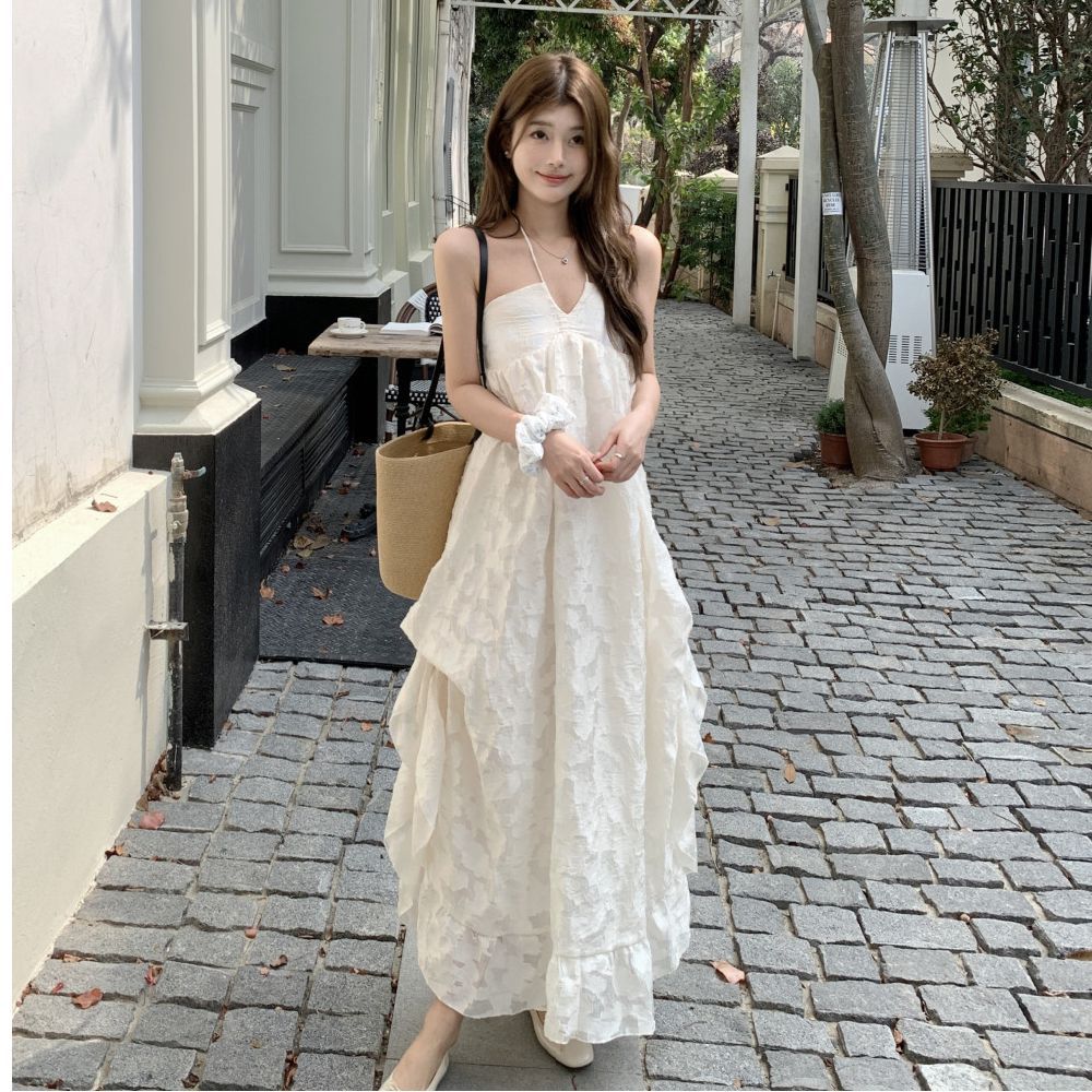 French temperament neck dress women's 2026 early spring new seaside vacation wind backless A-word long dress fairy dress