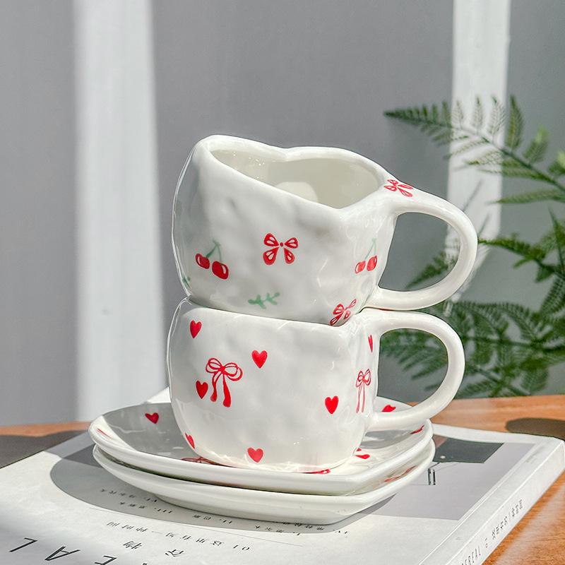Hand-squeezed hand-painted cherries, exquisite retro heart-shaped ceramic coffee cups and saucers, afternoon teacups