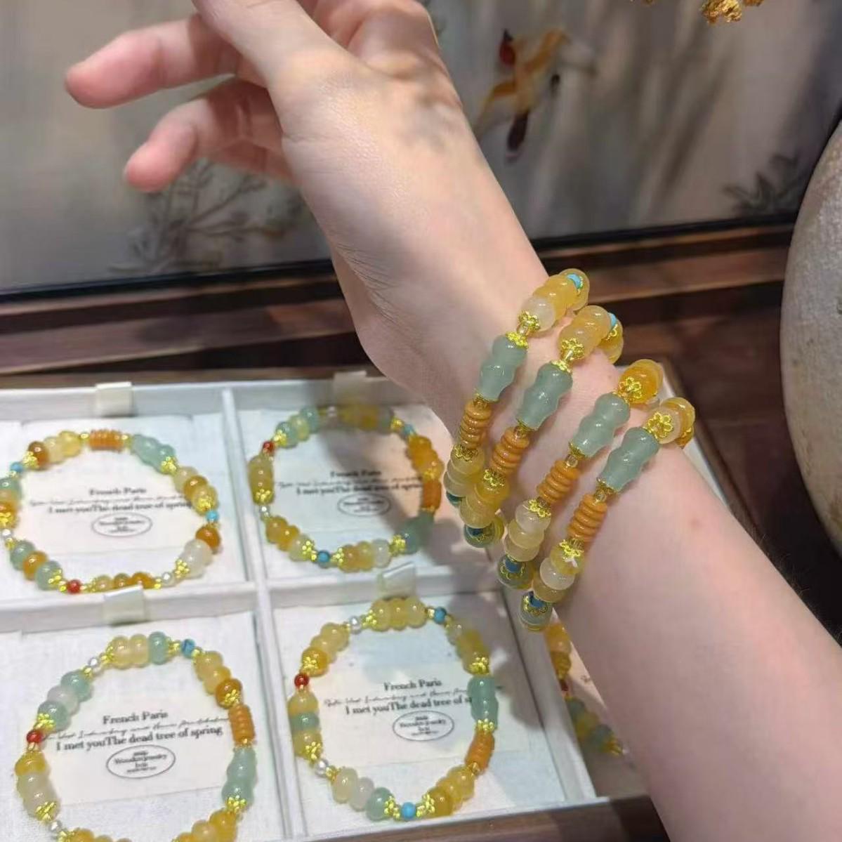 Hetian White Jade Gourd Bracelet with Gold Thread and Mutton Fat Jade Beads.