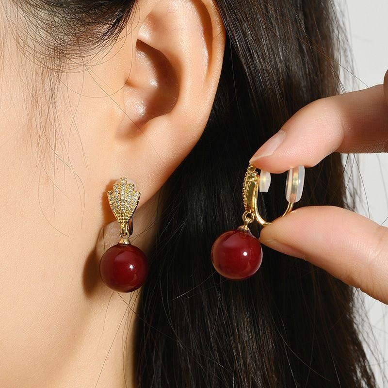 

Punch-Free Mosquito Coil Ear Clip Non-Pierced Female New Year Red Earrings Faux Pearl Earrings Fashion Niche Ear Jewelry Item No 699 red bead double rubber pad ear clip]