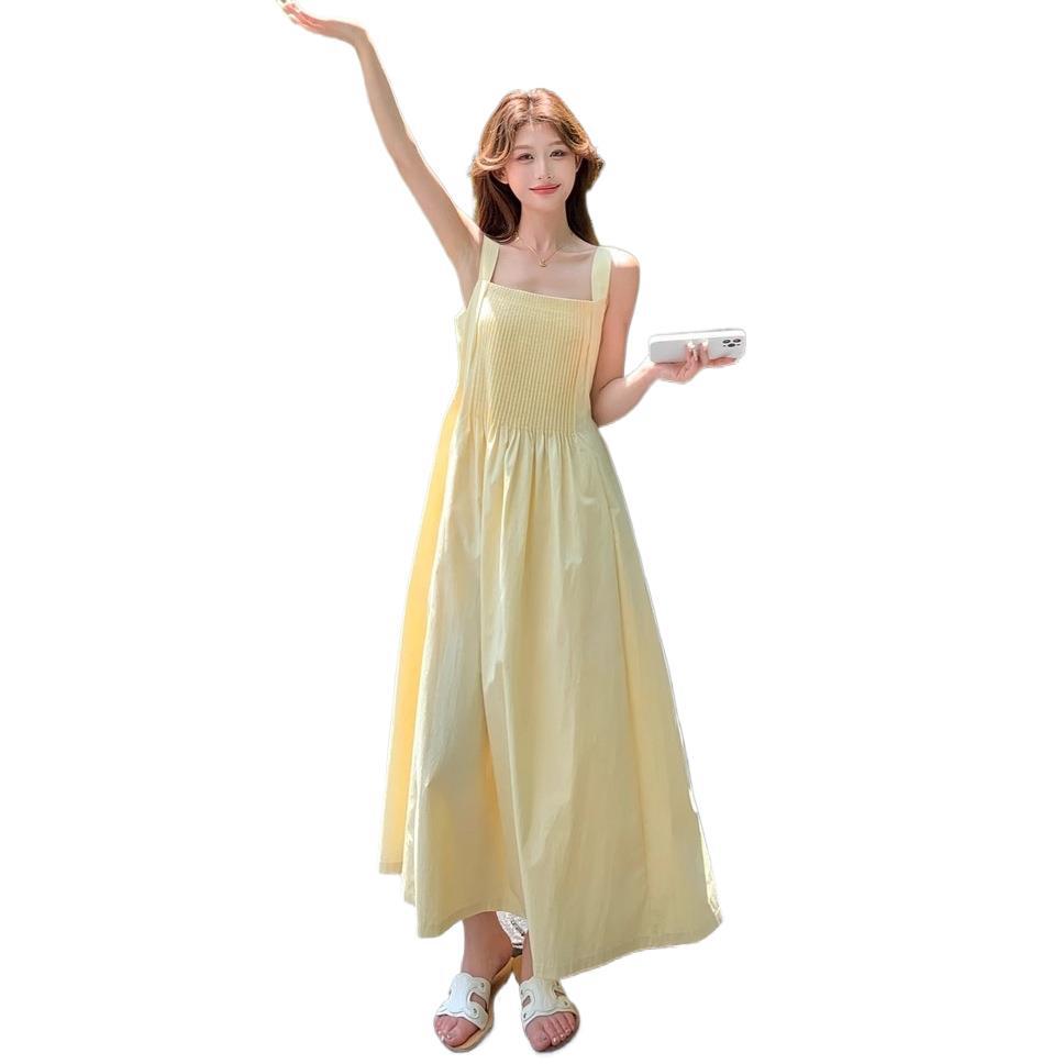 French Milk Yellow Pleated Suspender Summer Dress Female Sweet and Unique Beautiful Seaside Vacation Style A-shaped Long Dress