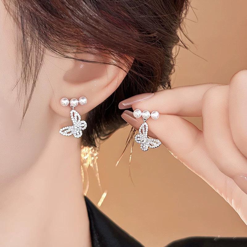 

New French retro hollow bow zircon pearl earrings earclip women s light luxury high-end stud earrings women s