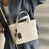 Retro woven small bag women's 2025 new niche design portable bucket bag commuter shoulder messenger bag