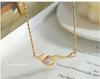 Celebrity-Inspired Gold-Plated Titanium Steel Necklace with Zircon Root-Shaped Pendant