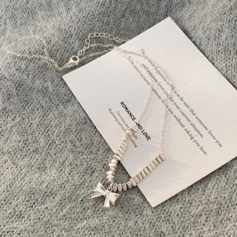 Elegant Silver Bow Pendant Necklace - Geometric Clavicle Chain for Women, Light Luxury, Versatile, Trendy Fashion Accessory