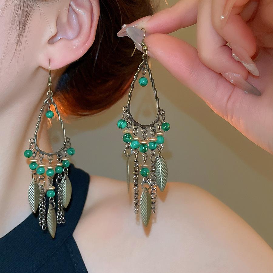 Retro ethnic style round hollow earrings Bohemian temperament elegant earrings niche fashion light luxury earrings women