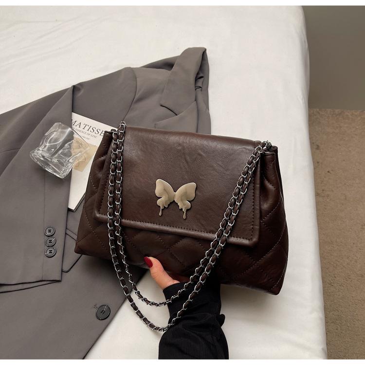 

Korean version of high-end tote bag fashion commuter chain bag women s simple versatile messenger bag niche casual shoulder bag темно-коричневого