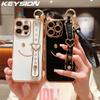 KEYSION Wrist Strap Smiley Face Phone Case for iPhone 13 14 15 16 17 Pro Max 17 Air 16e 16 Plus Plating Silicone Lanyard Shockproof Cover