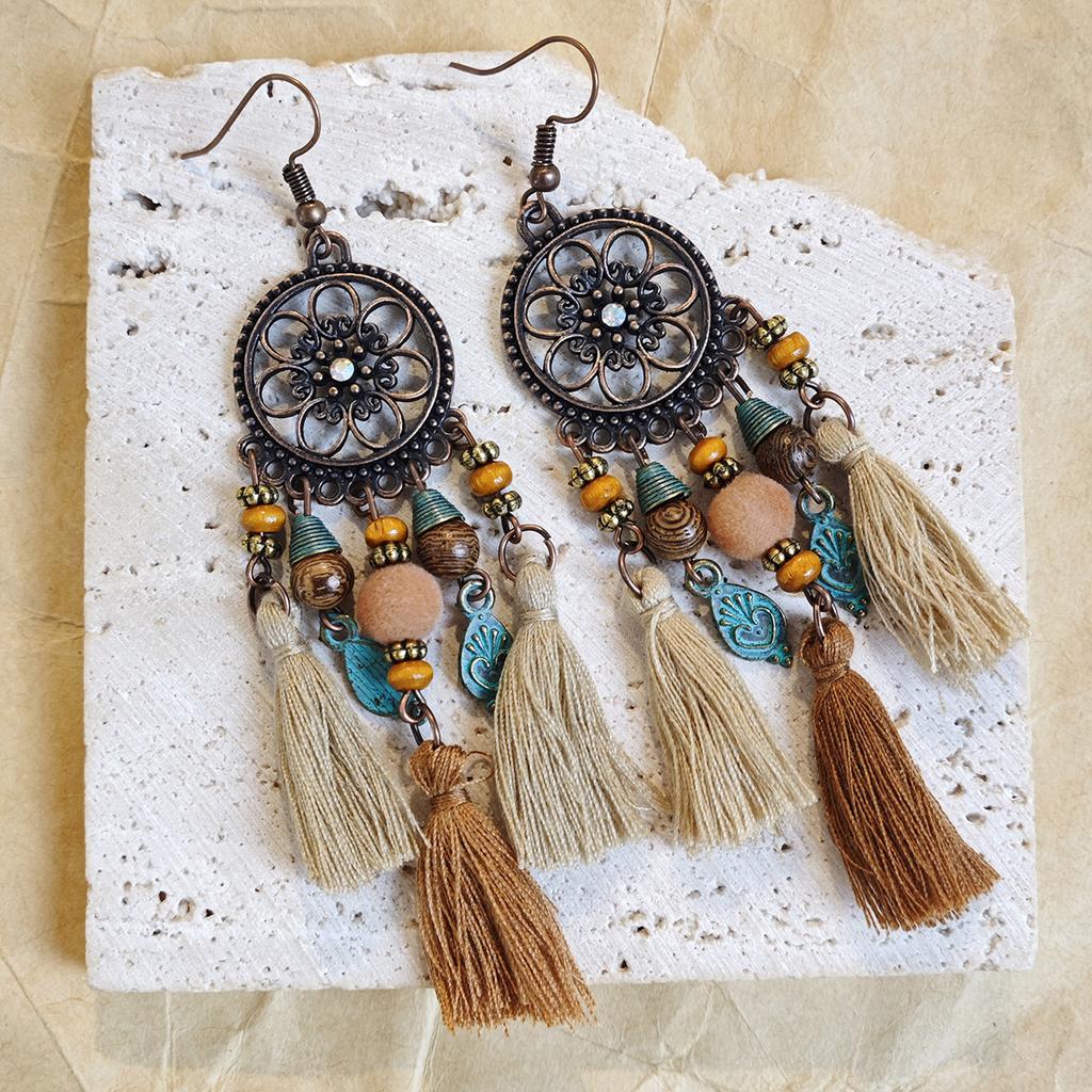 Retro ethnic style woven feathers long fringed earrings, bohemian high-end hollow rice bead earrings