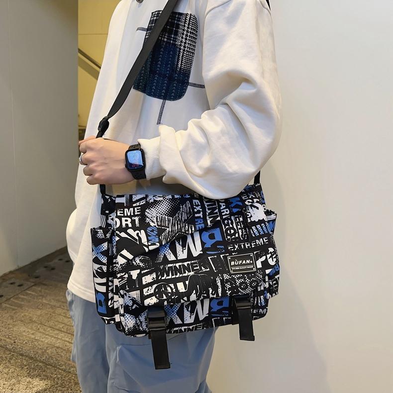 2024 Neue Street Herren- und Damen-Umhängetasche Großes Fassungsvermögen Bedruckte Schultertasche Koreanische Mode Studenten-Rucksack Aufbewahrungstasche
