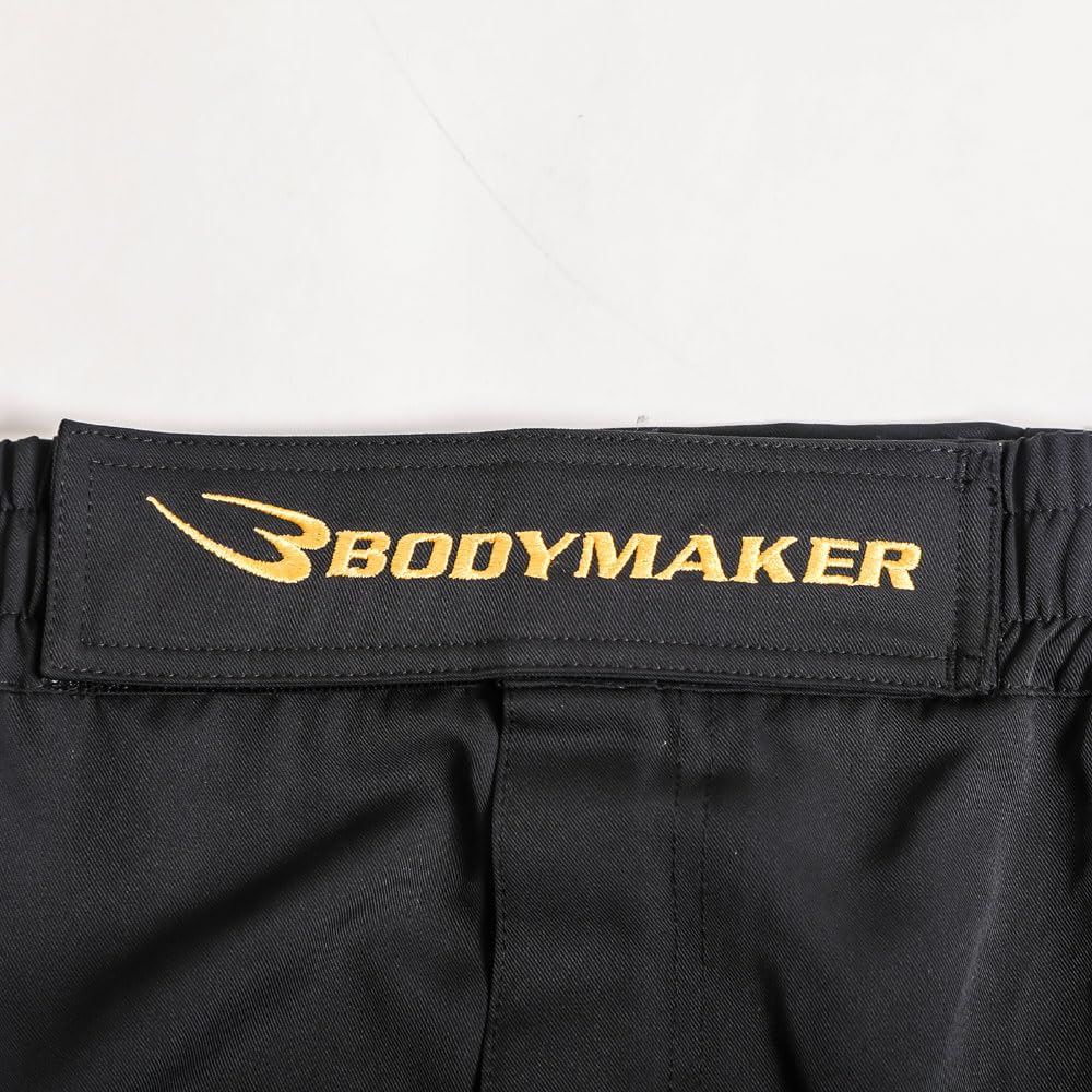 BODYMAKER Fight Shorts, Size L, Black x Gold. Perfect for kickboxing, MMA, boxing, Muay Thai, and other martial arts training.