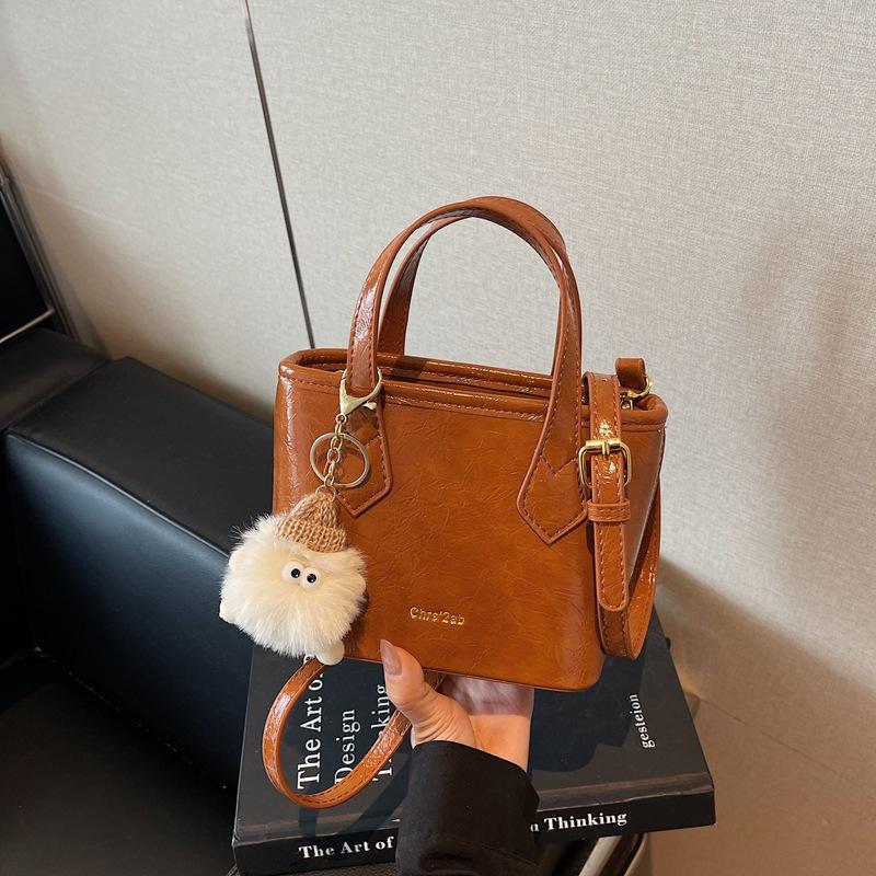 

Fashion portable bucket bag, solid color simple commute leisure niche versatile shoulder messenger bag women s bag коричневый