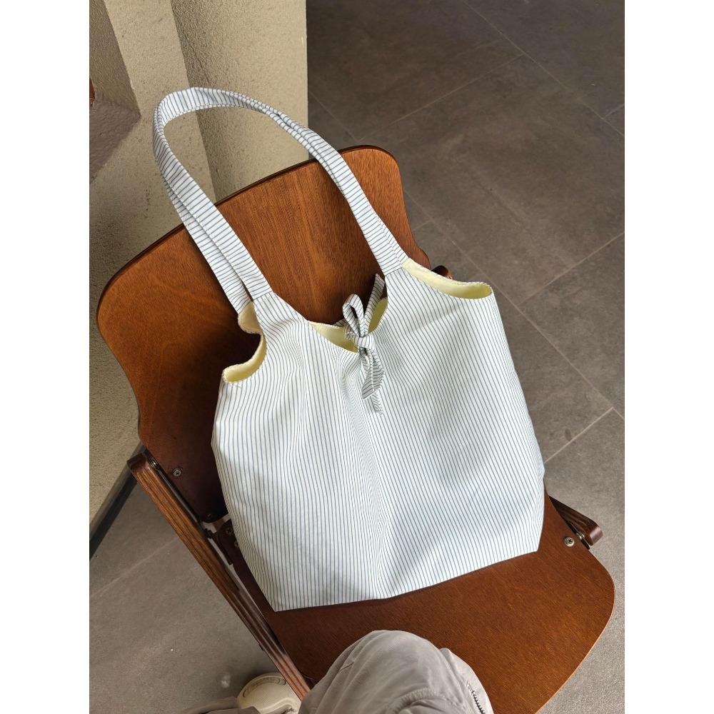 

Korean casual striped canvas bag women s 2025 new large-capacity shoulder tote bag student commuter armpit bag
