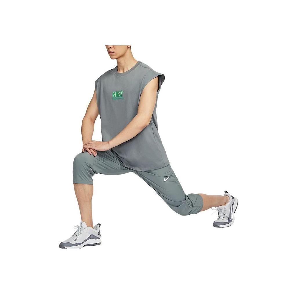 Nike Maglietta da Allenamento Senza Maniche a Vestibilità Ampia con Logo Uomo Top Grigio Fumo HJ3691-084