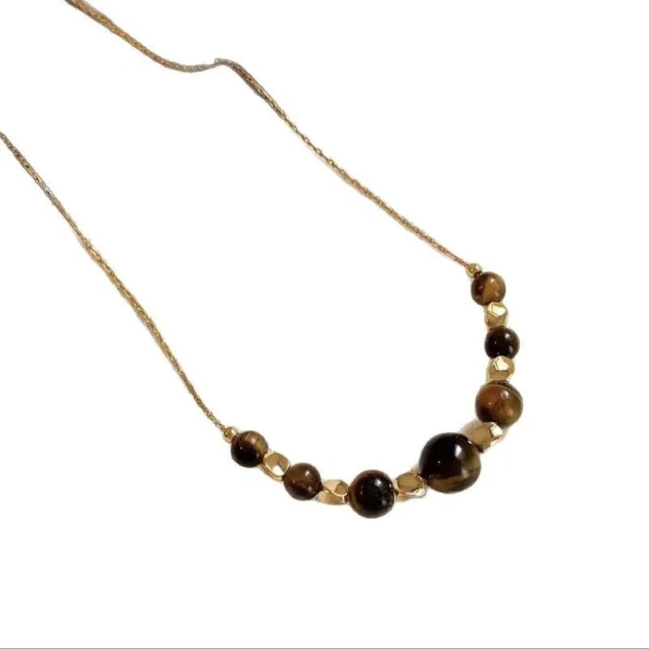 

Natural tiger s eye stone pendant sweater chain women s new Maillard style autumn and winter light luxury niche high-end temperament items