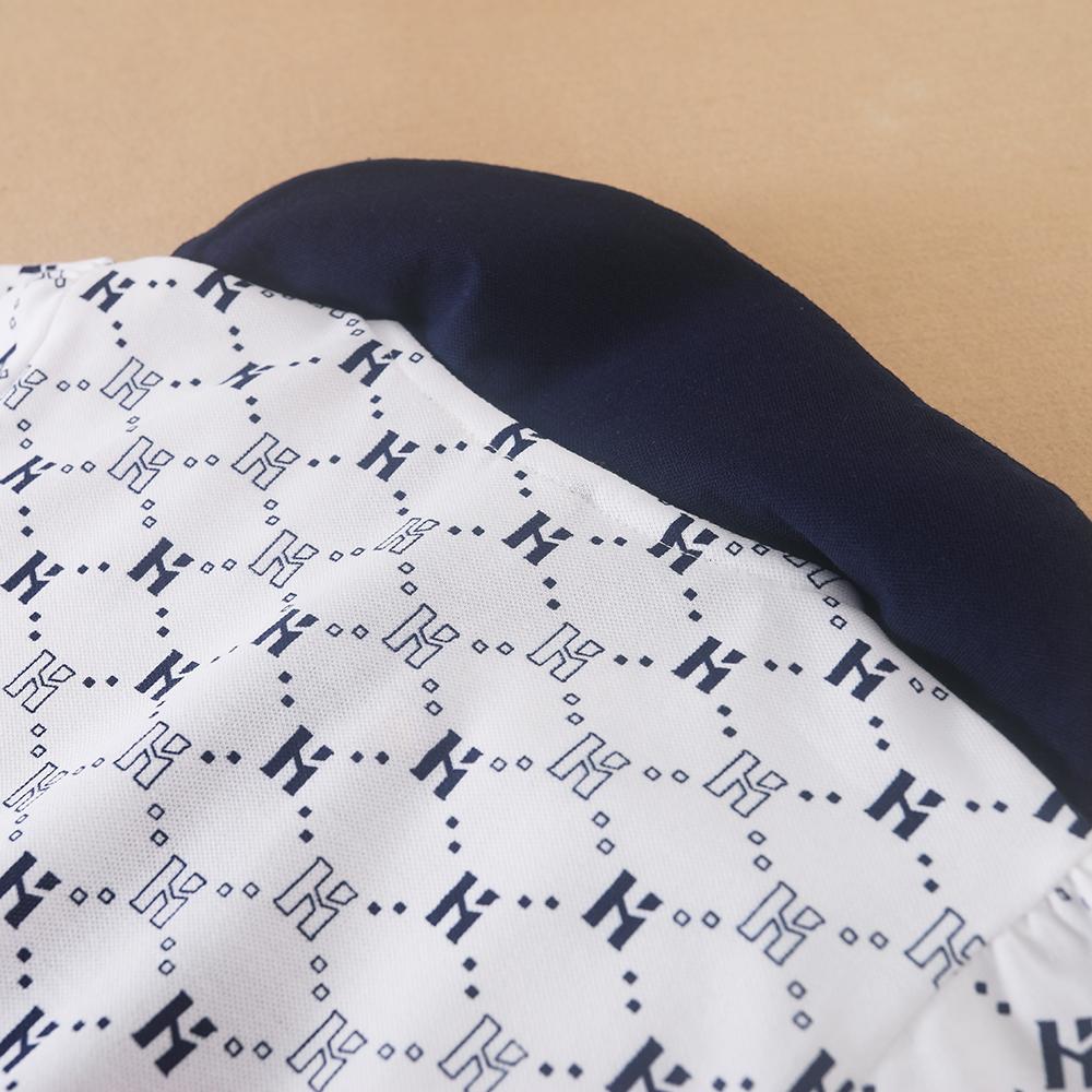 Flickornas tryckta pikétröja klänning med marinblå krage Kortärmad A-linjeformad klänning med monogrammönster Barnvita sommarklänningar