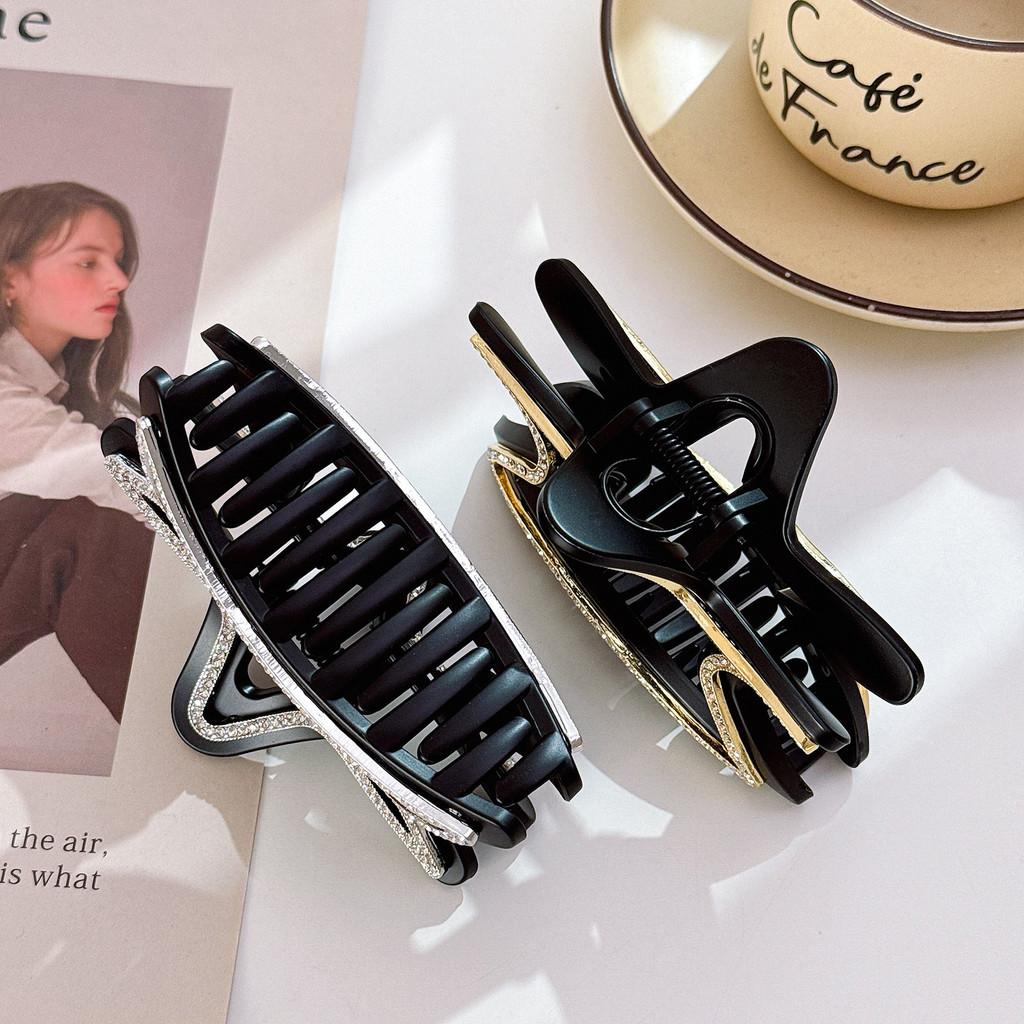 Elegant stjärnformad hårklämma för kvinnor med fantastiska strass i svarta och bruna toner