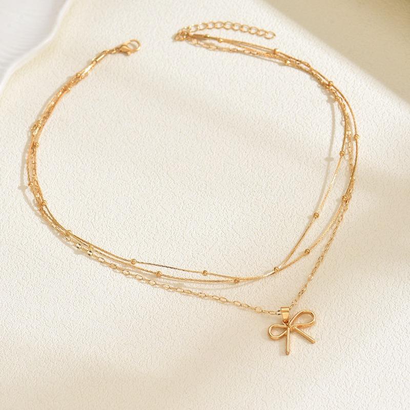 Fashion simple alloy bow pendant necklace light luxury niche multi-layer stacked bead chain necklace