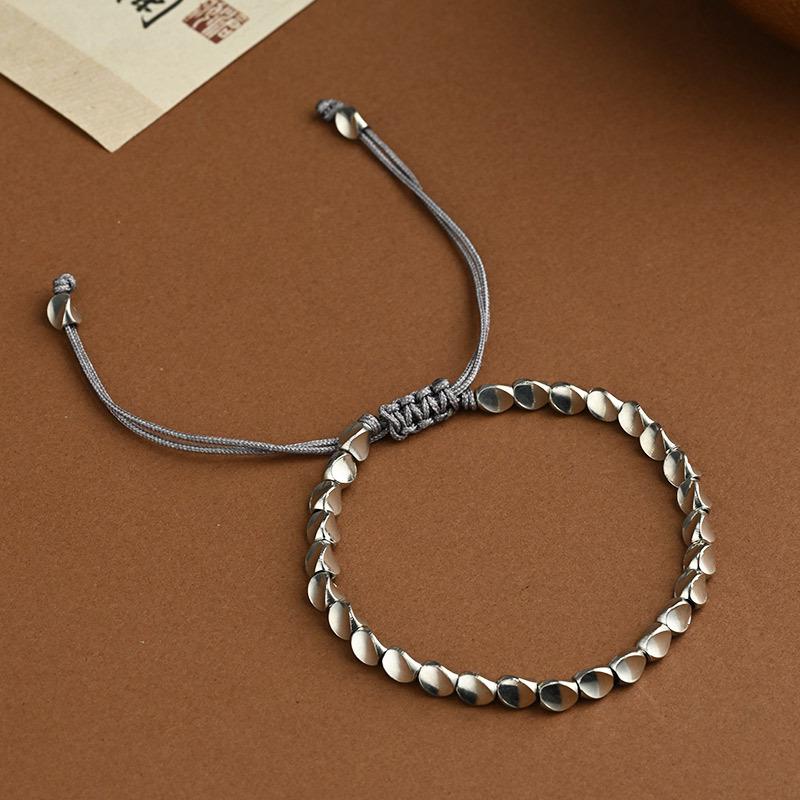 Handgemaakte Geweven Armband met Irreguliere Koperen Kralen en Creatief Kwastje Trekkoord