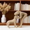 A Woman Kissing a Small Dog Resin Figurine a Warm Pet Interaction Scene Sculpture Sandstone Resin Ornament