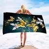 A women's oversized beach towel that is soft quick-drying and super absorbent with a beautiful butterfly and flower design