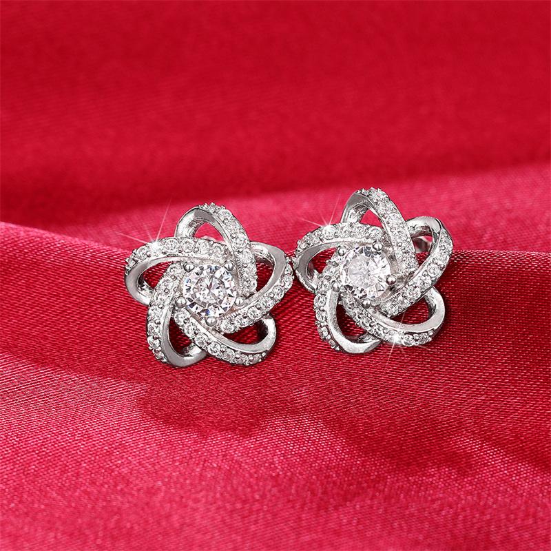 Huitan Boucles d'oreilles clous éblouissantes en forme de fleur pour femmes Bling Bling Zircone cubique Délicats Accessoires de piercing d'oreille Bijoux de mode