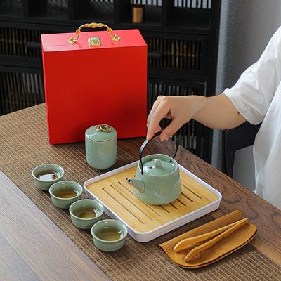 Ge-Ofen Reise tragbares Kung-Fu-Tee-Set Geschenk eine Kanne vier Tassen Teetablett Büro Porzellan Geschenk