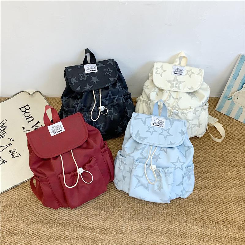 Schoolbag Korean sweet and cool drawstring backpack 1011 new five-pointed star printed schoolbag large capacity versatile cute small backpack