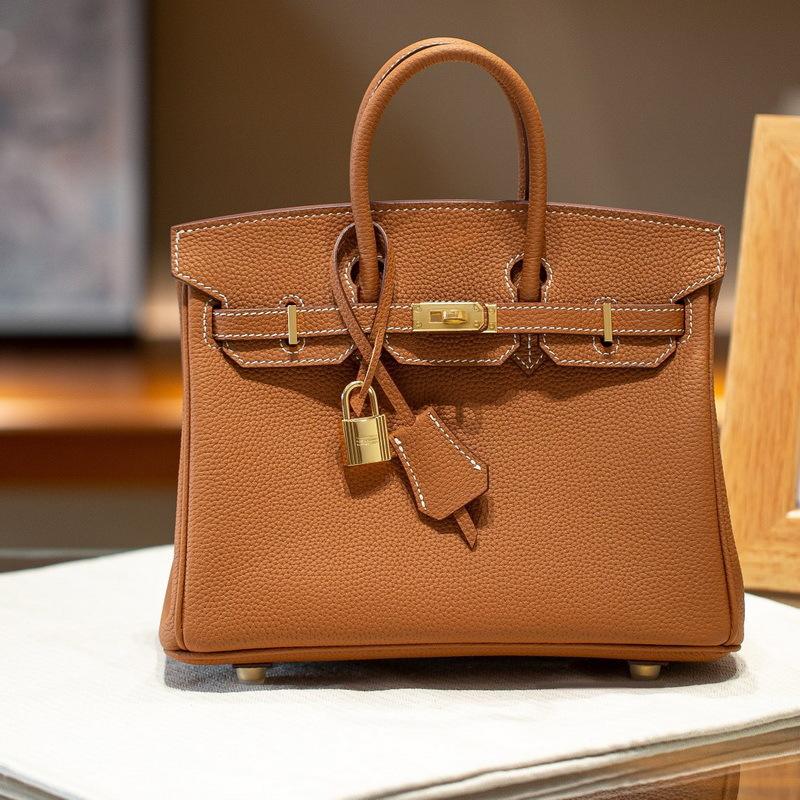 Gold buckle silver buckle top layer cowhide togo leather platinum bag (togo-2530BK)