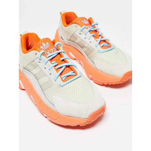 

Кремово-белые кроссовки adidas Originals ZX 22 Boost с оранжевыми деталями