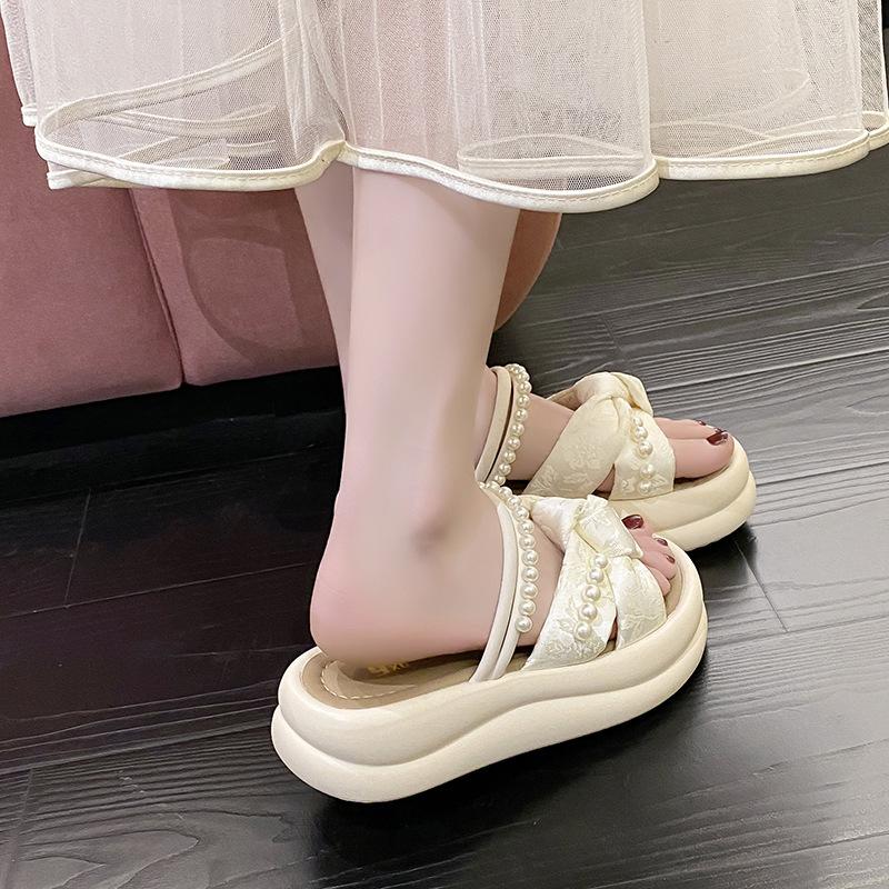 thick-soled pearl slippers for women to wear in the summer of 2025, new one-character cross-strap flat-bottomed cool slippers for women