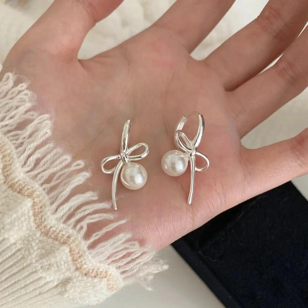 Silver Bow and Pearl Earrings: Elegant, Luxurious, Versatile Women's Accessories
